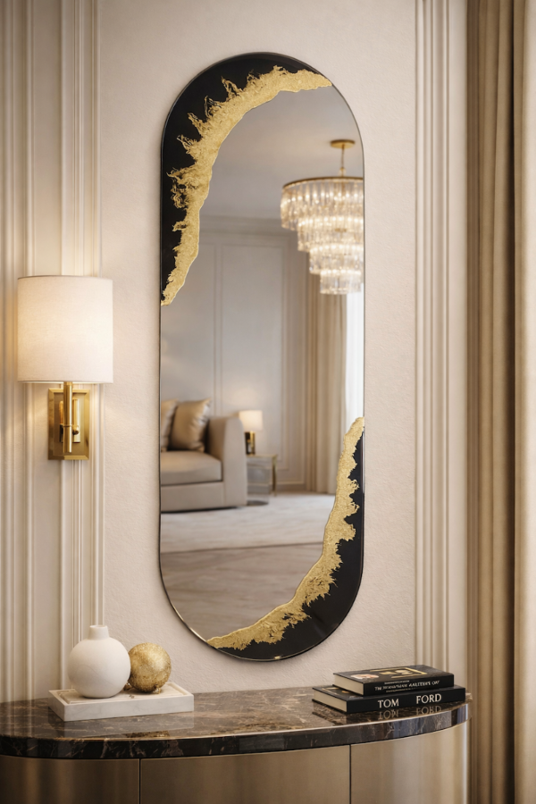 Decorative mirror with gold frame in a stylish interior setting.